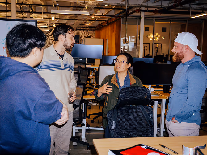 The Base team huddling on a problem