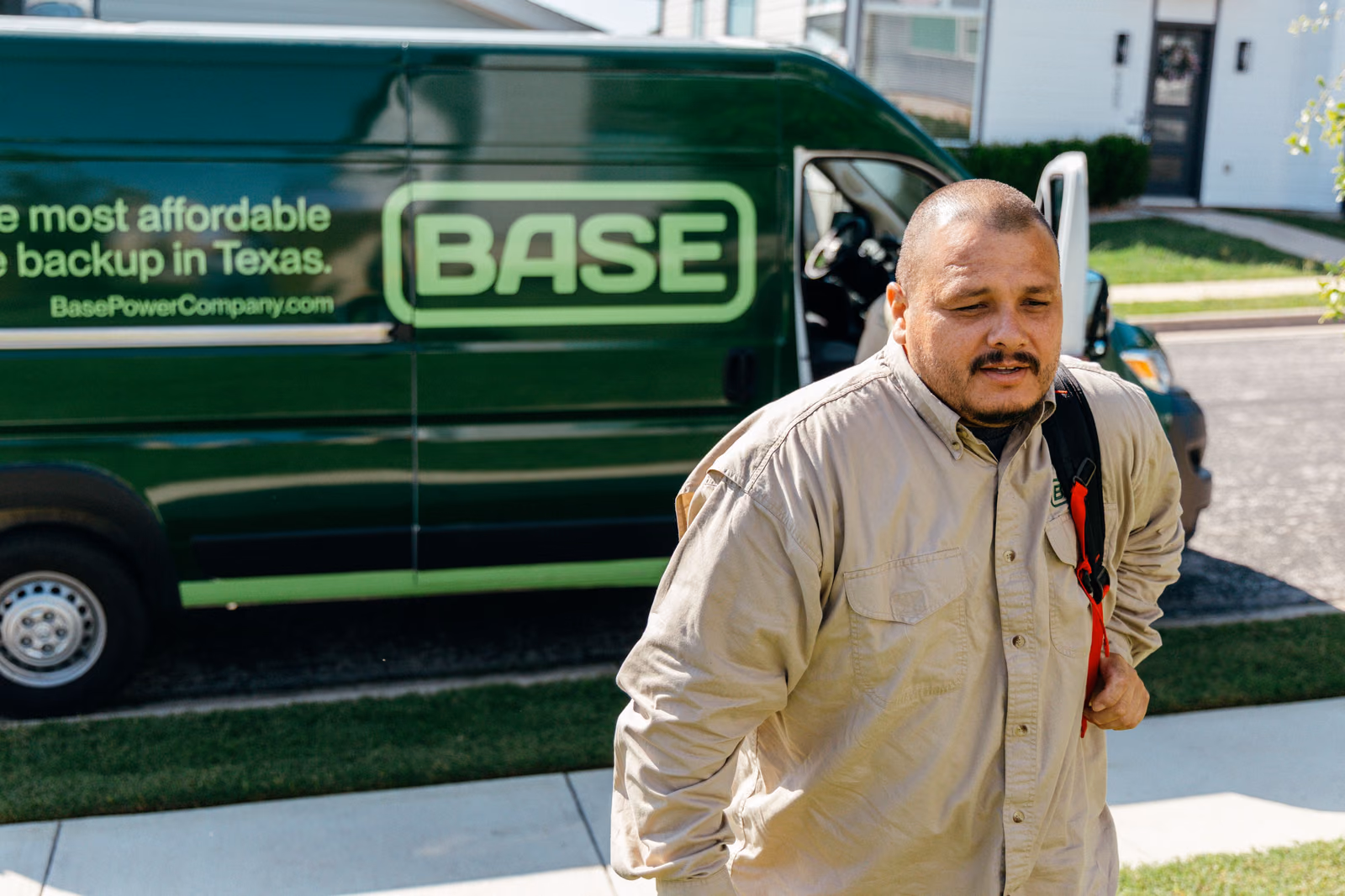 A Base field technician beside the service van