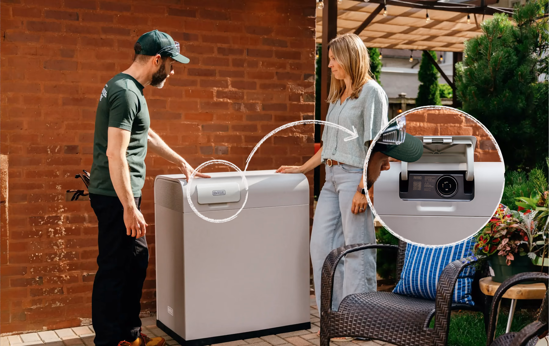A Base technician and a homeowner beside a Core battery, with the generator recharge port highlighted