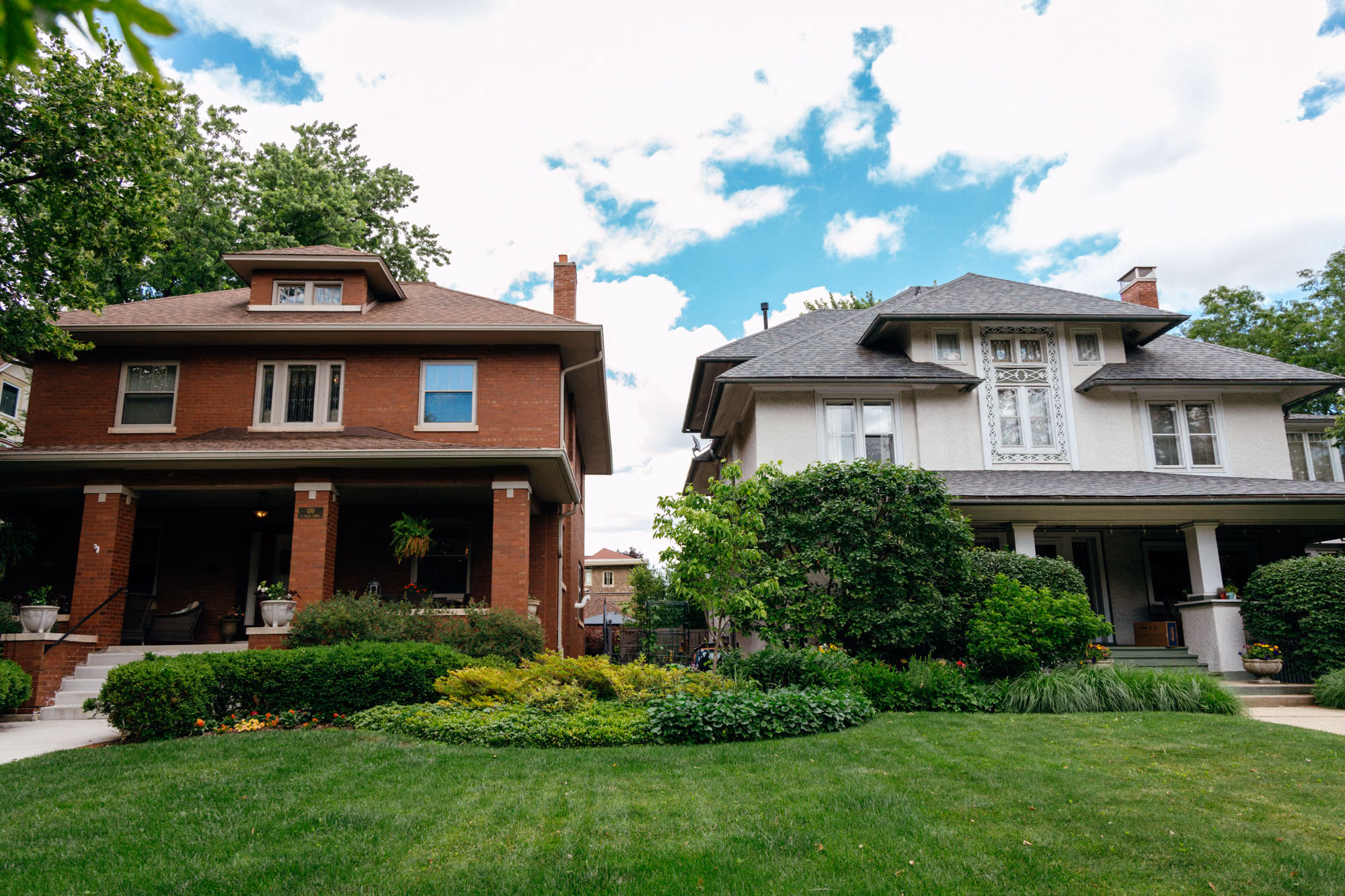Two Illinois homes on a tree-lined street