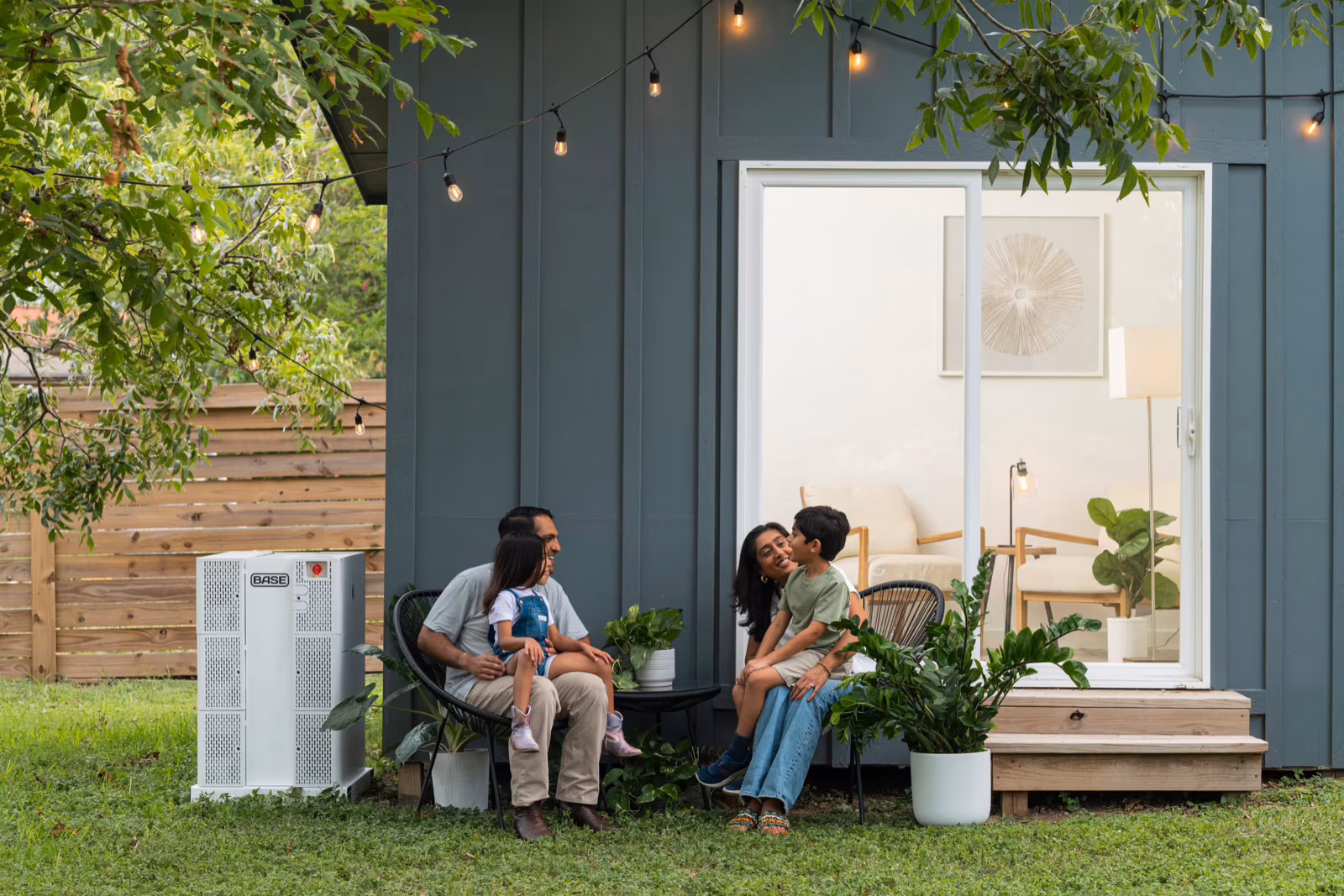 A family at home, kept powered by a Base battery