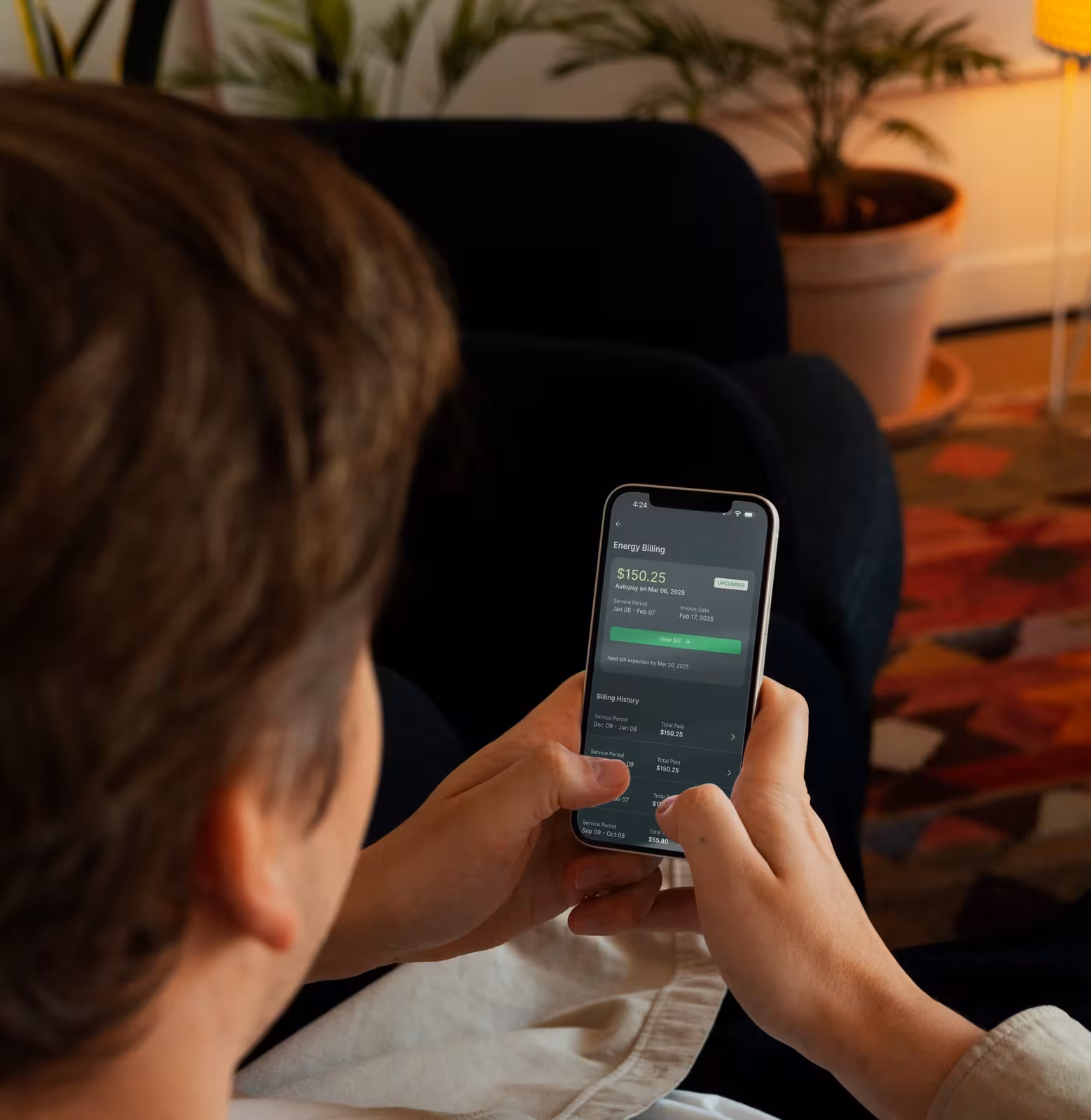 A homeowner using the Base mobile app.