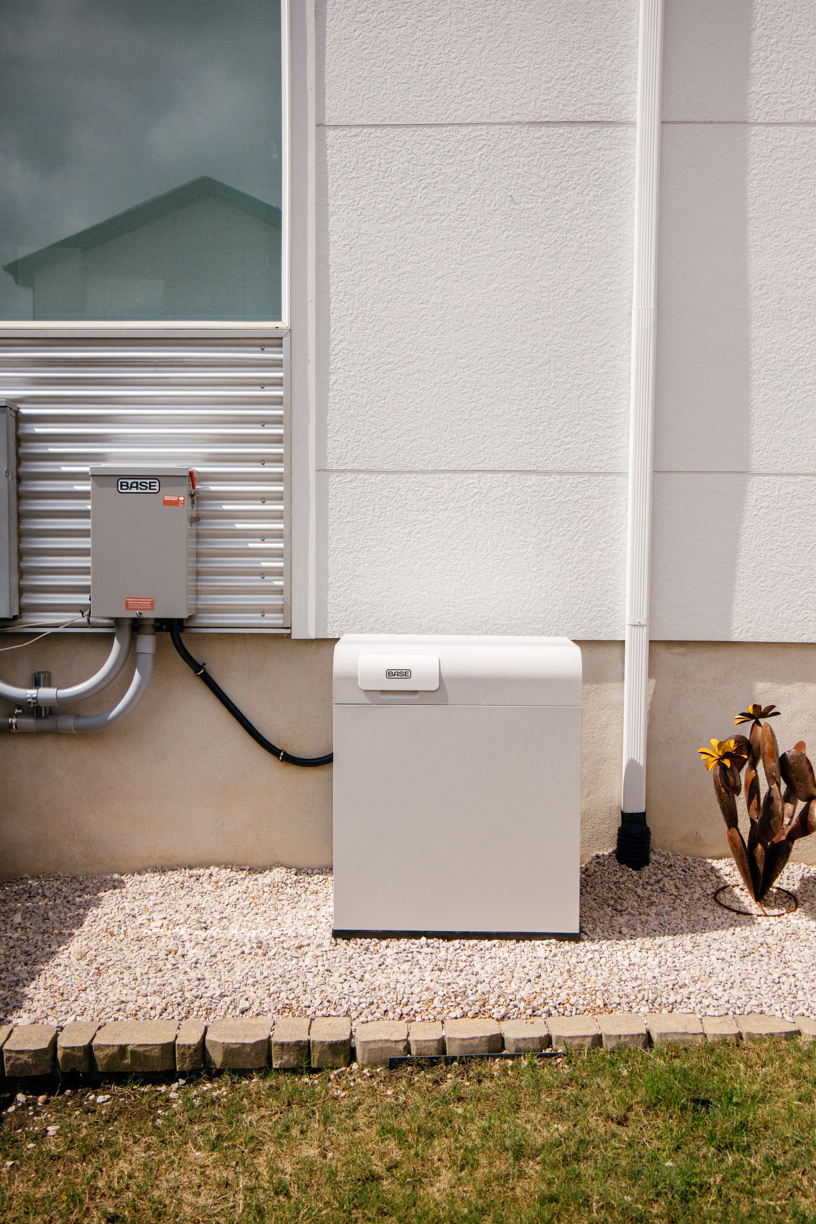 A single ground-mounted Base battery installed at a home
