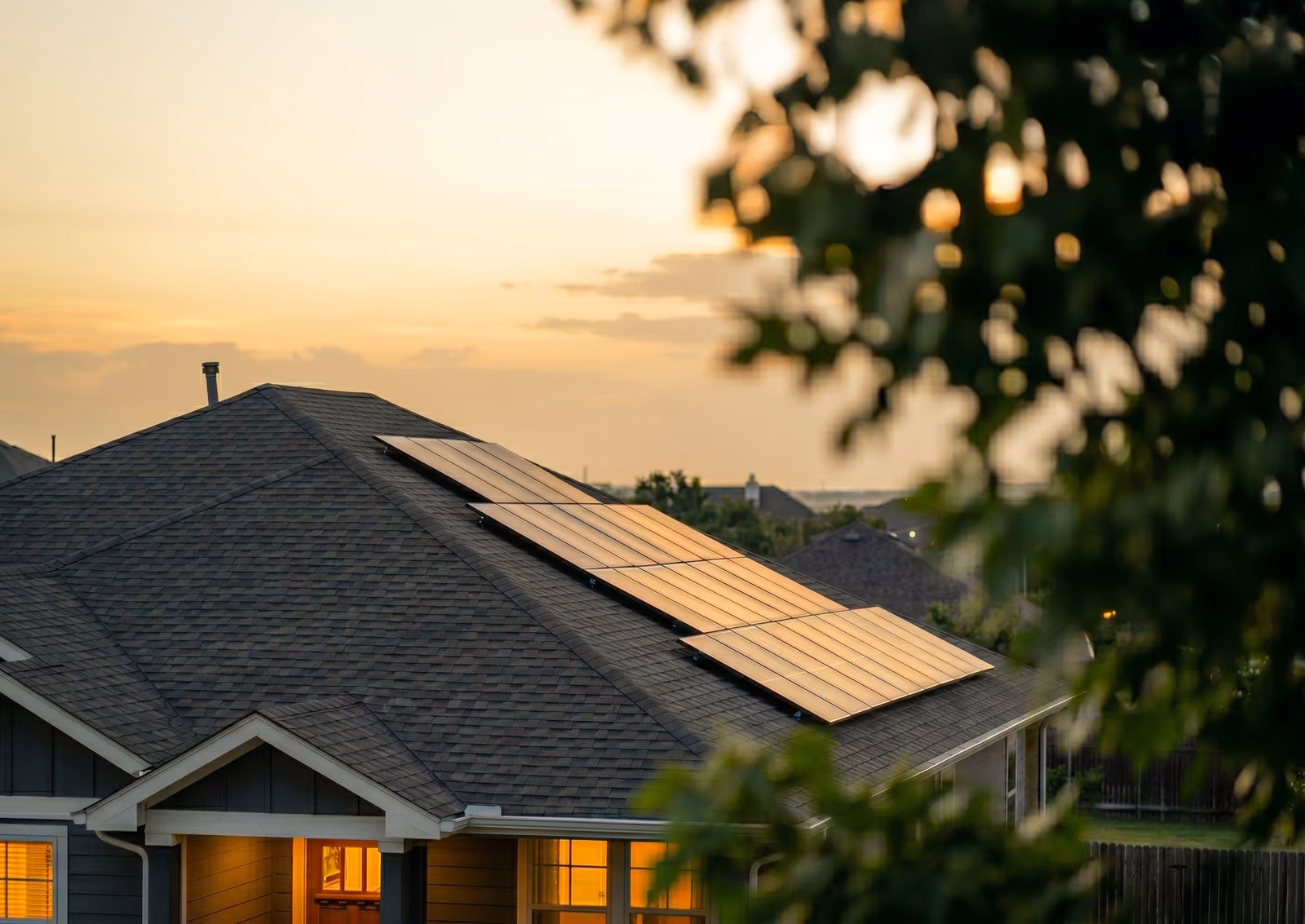 A Texas home with rooftop solar panels at sunset